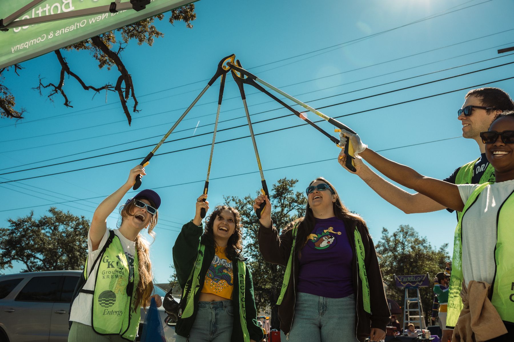 Volunteer crew with pickers raised in celebration